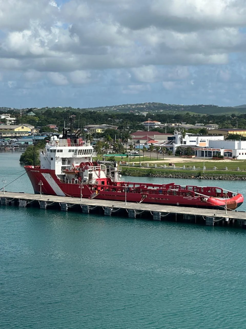 SM Caribbean's bunkering vessel alongside a quay